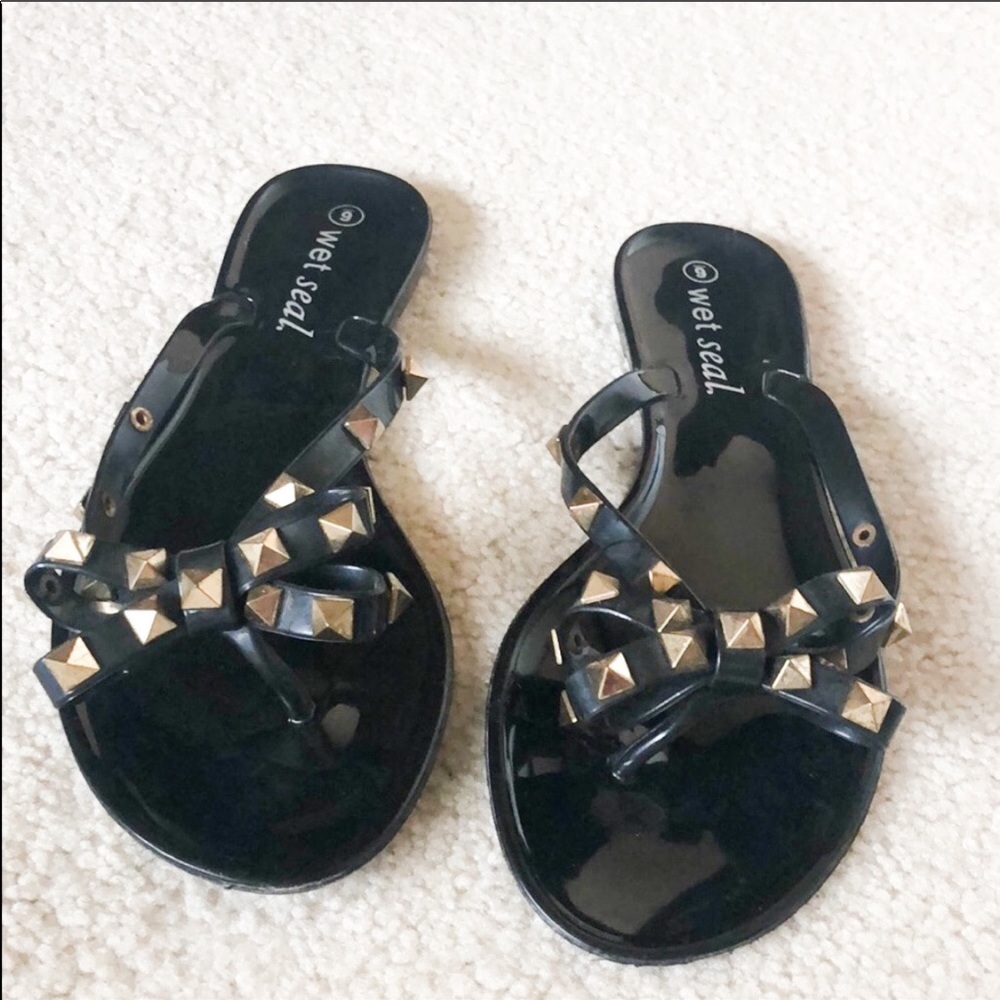 Black studded bow flip flop sandals. Size 6